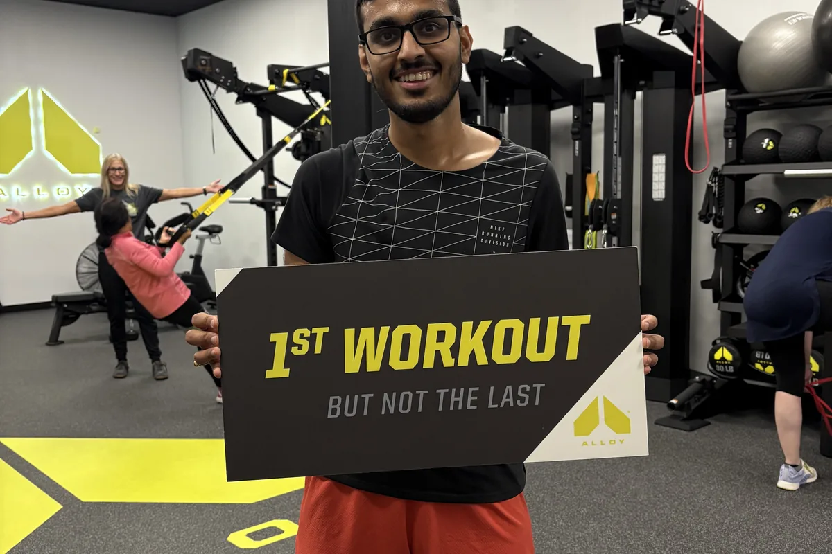 Member celebrating a first workout milestone at Alloy Cary